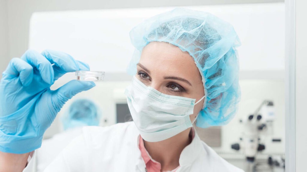 lab scientist looking at a sample