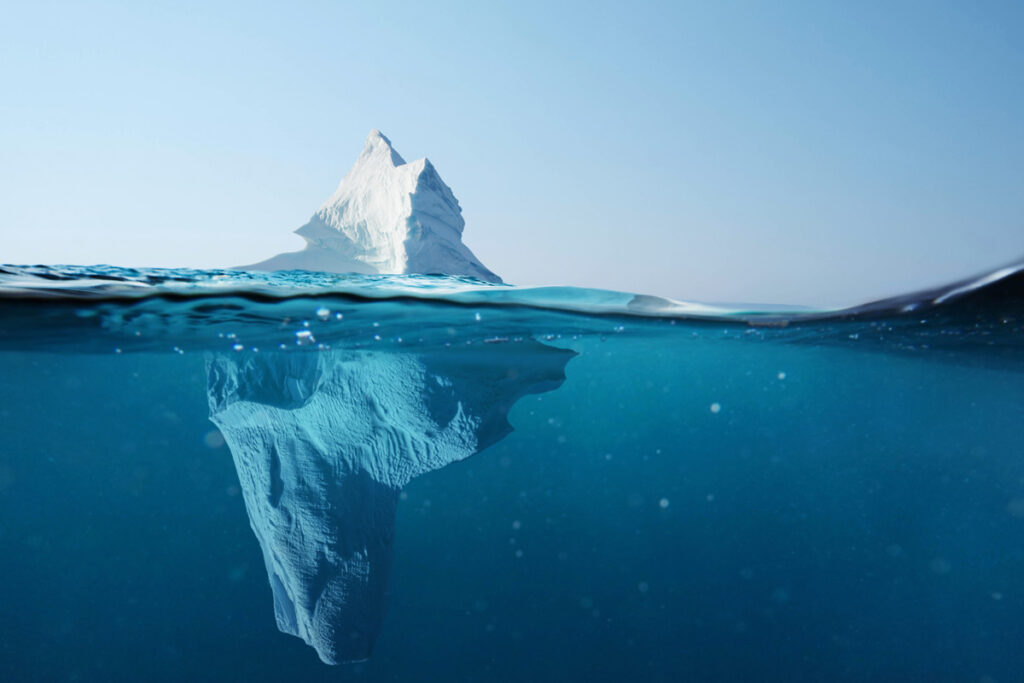 Iceberg in the ocean with a view under water.