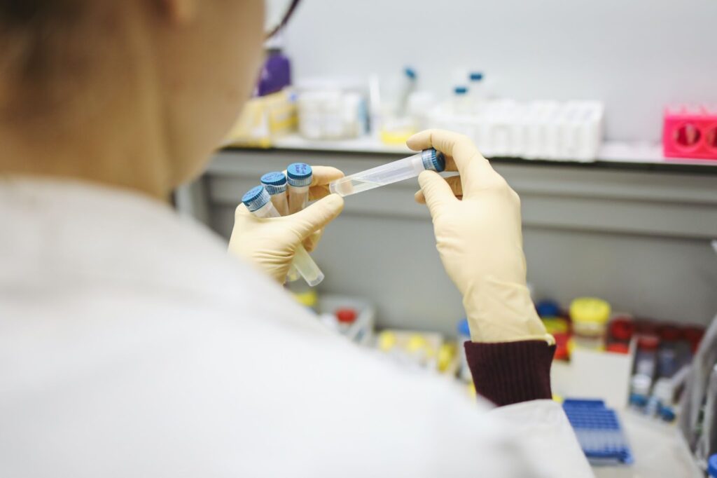 Scientist holding vial