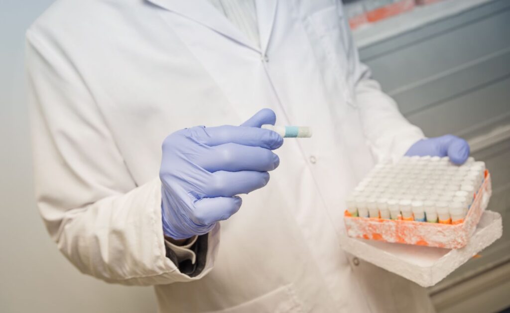 scientist with a sample in the hand